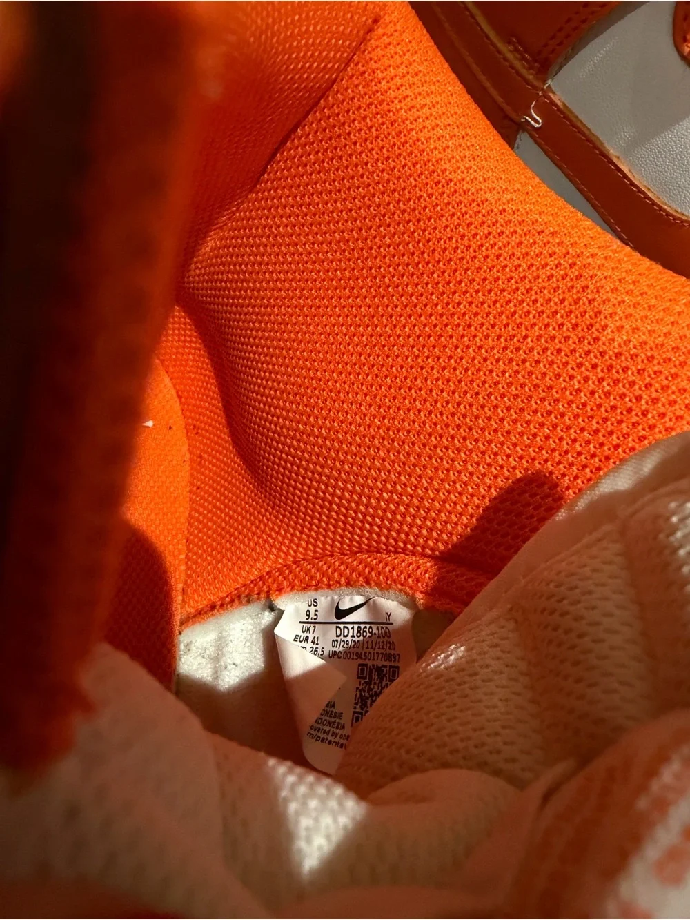 Nike women’s High-Top Sneakers in Orange and White